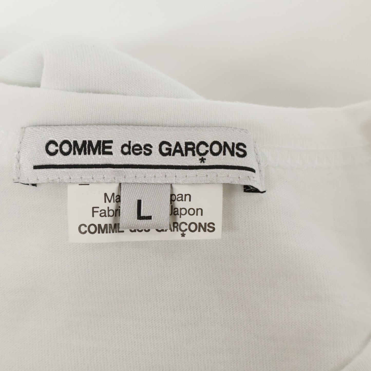 COMMEdesGARCONS コムデギャルソン 白 ｺｯﾄﾝ WEAR YOUR FREEDOM Tｼｬﾂ トップス L