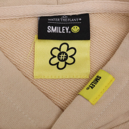 WATER THE PLANT ウォーターザプラント ﾍﾞｰｼﾞｭ ｺｯﾄﾝ ｽﾏｲﾘｰﾛｺﾞ ﾊﾞｯｸﾌﾟﾘﾝﾄ ｽｳｪｯﾄﾌｰﾃﾞｨﾌﾟﾙｵｰﾊﾞｰ トップス M